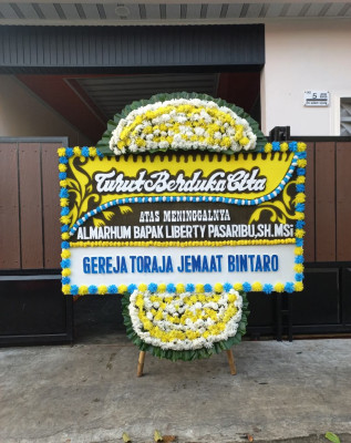 Papan Bunga Duka di Negeri Olok Gading